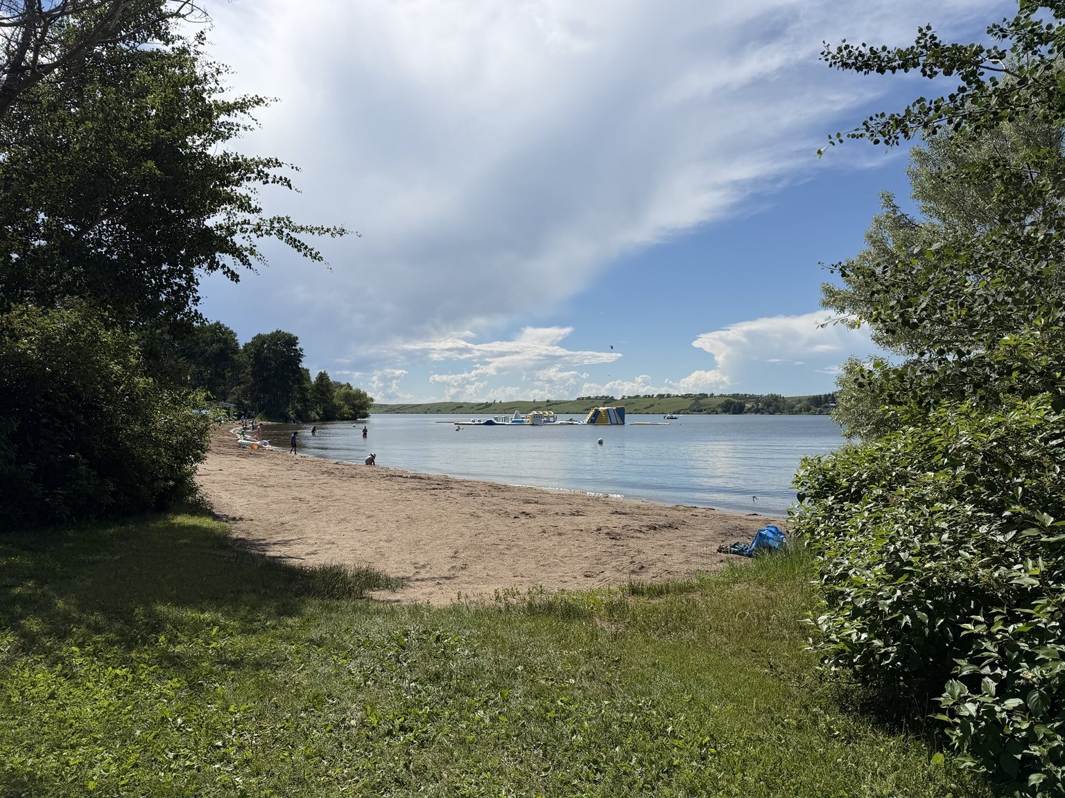 Sandy beach and calm water at Blackstrap Lake