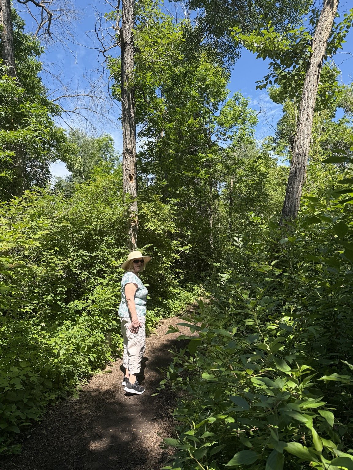 Grandmother walking on the wooded Gift of Green Nature Trail