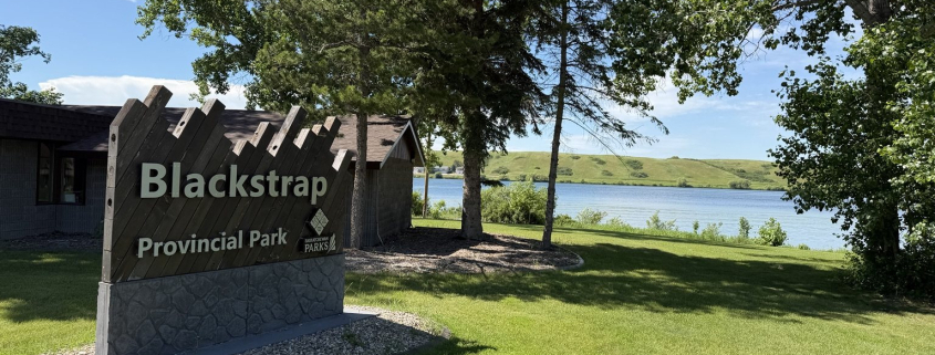 Blackstrap Provincial Park entrance sign with Blackstrap Lake in the background