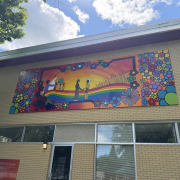 Colourful reconciliation mural created by Kevin PeeAce with Humboldt youth