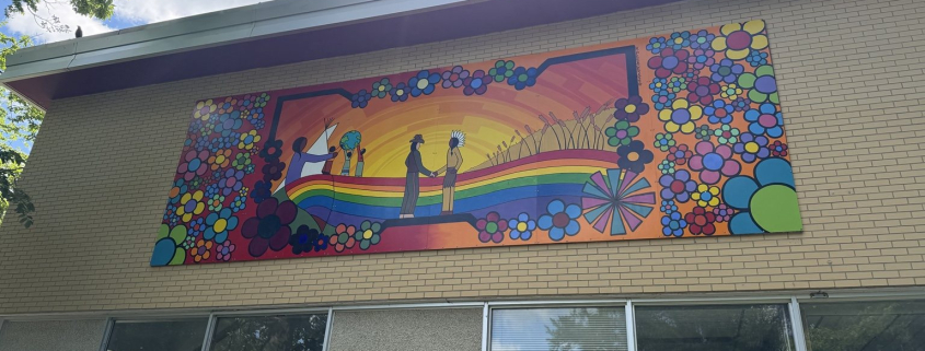 Colourful reconciliation mural created by Kevin PeeAce with Humboldt youth